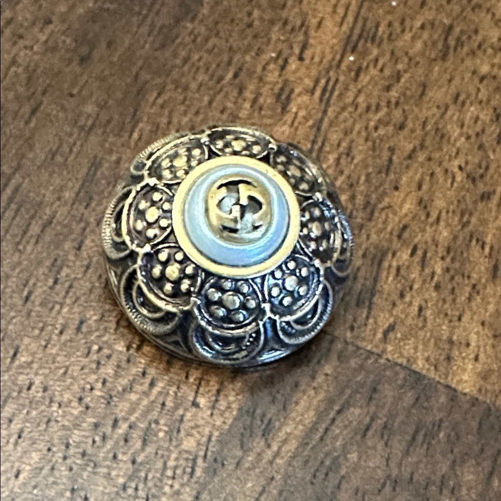 Gucci Intricate is Silver and Black Button